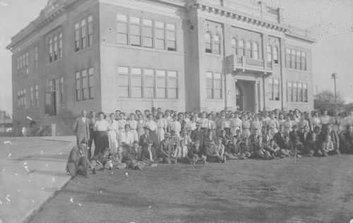 Orange Union High School students and faculty on the lawn outside the Academic Building, Orange, California, ca. 1908