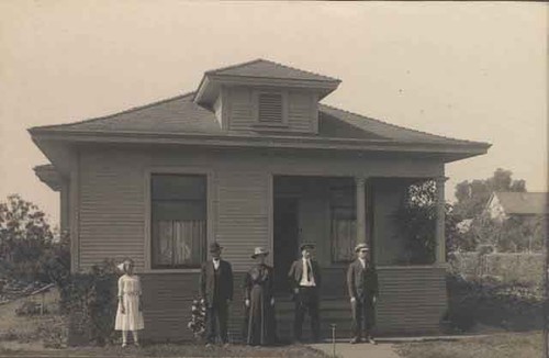 People in front of house