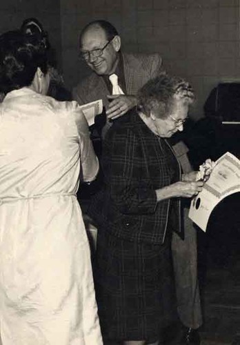 Lady receiving certificate