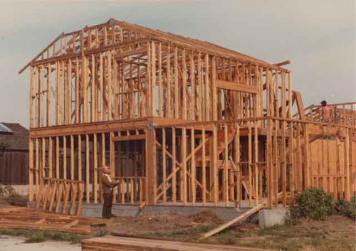 Inspector checking construction on large house