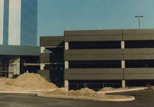 Construction on parking structure by high-rise