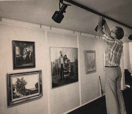 Volunteer adjusting lights