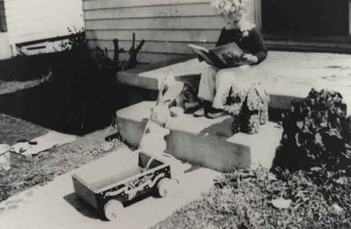 Elaine reading book on her porch