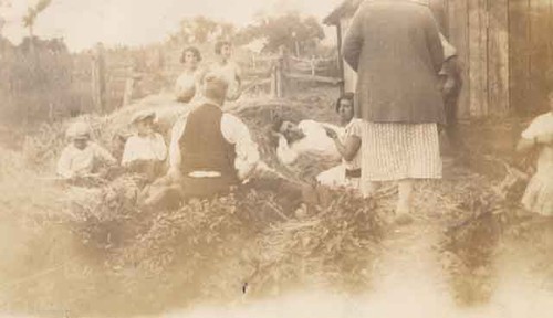 Family resting in the hay