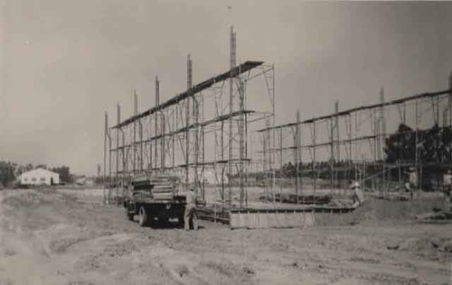 Truck next to frame for new building