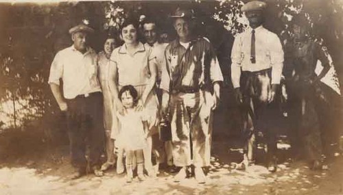 Family posing with Sulphur Mt. sheepherder