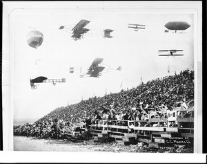 Composite photograph of early-model airplanes, a dirigible, a hot-air balloon and bleachers filled with spectators at the 1910 Dominguez Field Air Meet, January 1910