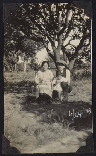 Man and woman posing with child