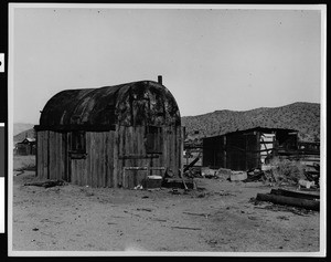 Exterior view of a ramshackle cabin in Randsburg, ca.1924