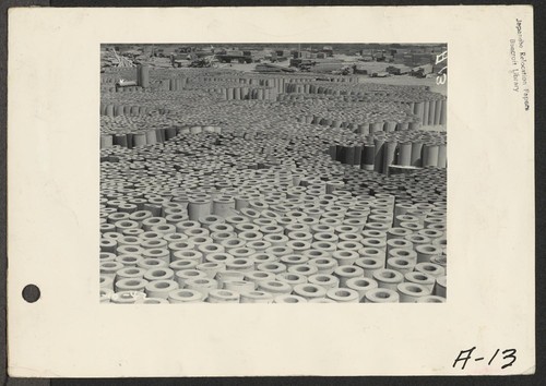 Parker [Poston], Ariz.--Rolls of roofing paper used in the construction of the War Relocation Authority center located on the Colorado River Indian Reservation. Photographer: Albers, Clem Poston, Arizona