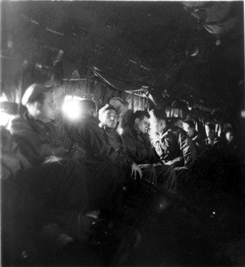 Marines inside airplane at night