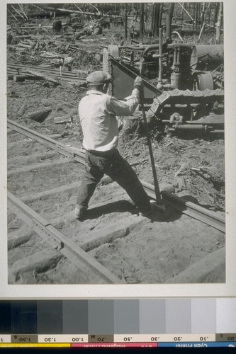 Pulling spikes on logging road