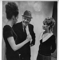 Tavern owner Leonard Glacy with Susanne Haines (left) and Shiela Brendenson, "bottomless dancers," on day of court appearance before Municipal Judge Earl Warren Jr