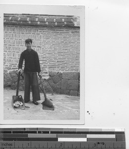 A street cleaner in China, 1947