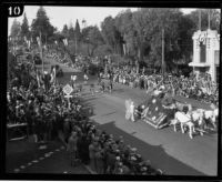 Float drawn by horses and Bagpipe band in the Tournament of Roses Parade, Pasadena, 1926