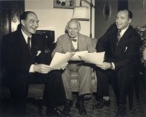 Dr. Lee de Forest and two men reading