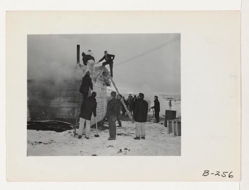 Quick work, by the evacuee Fire Department, kept the fire, which broke out in the office located at the old hog farm, from doing other than minor damage. Photographer: Stewart, Francis Newell, California