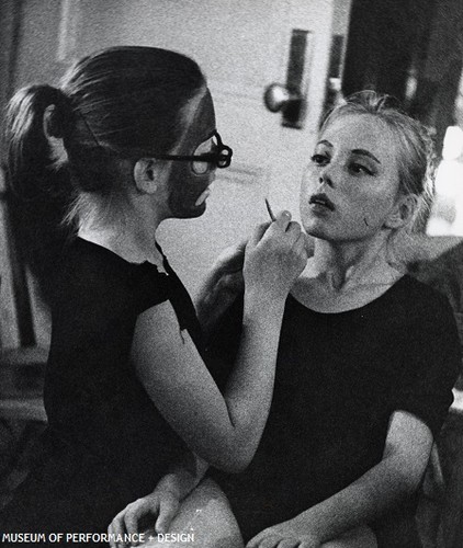 Child dancer applying makeup to a fellow child dancer preparing for Christensen's Nutcracker, 1954