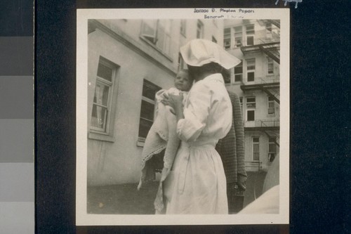 [Nurse with baby Alice Doyle]