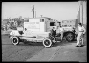Truck and rising car, Southern California, 1931