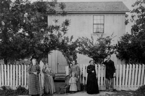 Visalia residents near home on Strawberry Ave. ,1896