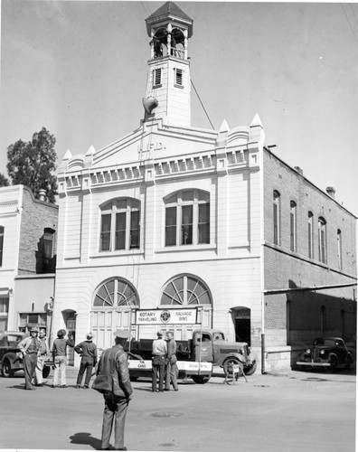 Removing Fire Bell for Scrap Metal Drive During WW II