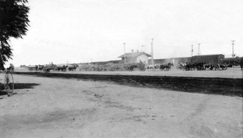 Southern Pacific depot with wool and grain waiting for shipment