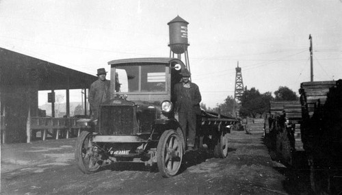 Truck at the back of Associated Oil Co. warehouse