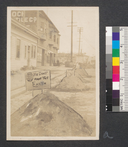 [Street scene during reconstruction following earthquake and fire of April, 1906. House cleaning day, March 3, 1907. San Francisco. Retouched photographic print.]