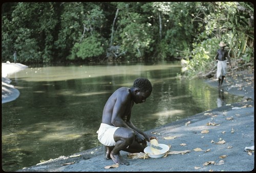 Man working at shore