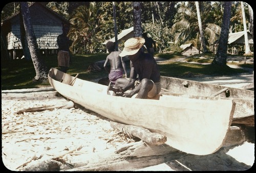 Carving a canoe