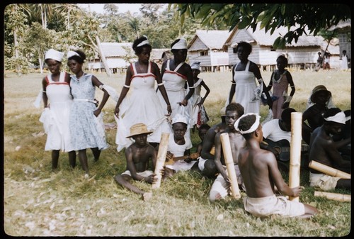 Musicians, and dancers dressed in white