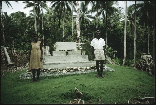 Woman and man in front of a chief memorial