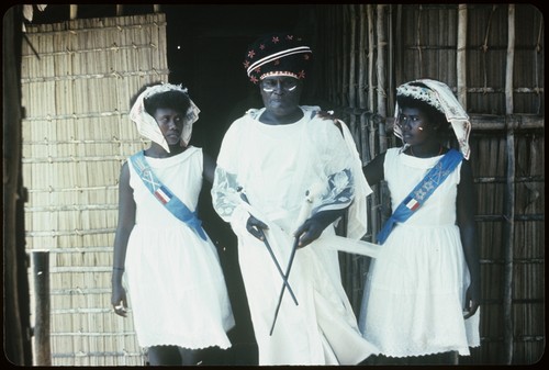 Holy Mama and two girls in front of church