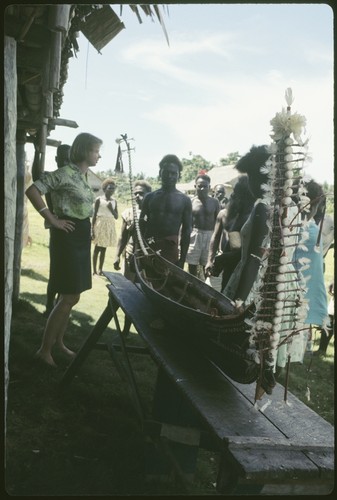 Group with miniature canoe