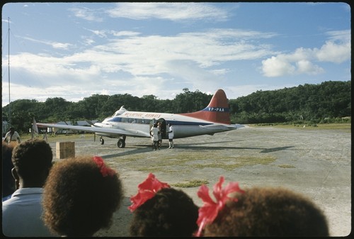 Group watch as Frances Harwood boards airplane