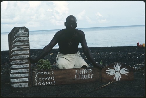 Man with writing replicas on wooden board