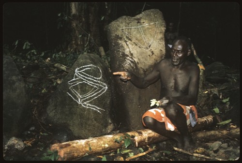 Man with rock drawings