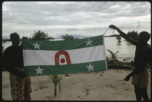 Men holding up a Christian Fellowship Church flag