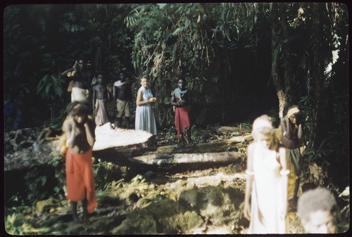 Group walking with European woman