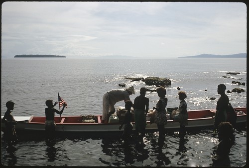 People loading a canoe