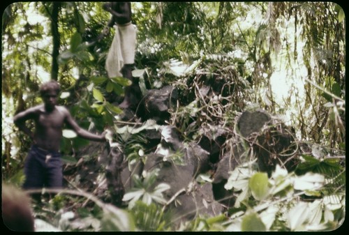 Portrait, man beside shrine