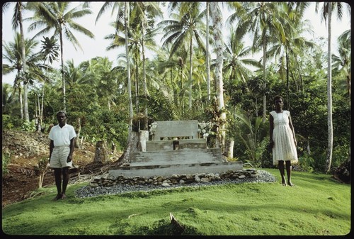 Woman and man in front of a chief memorial