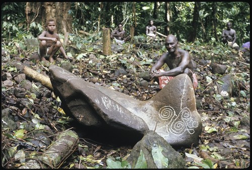 Man and boy with petroglyph