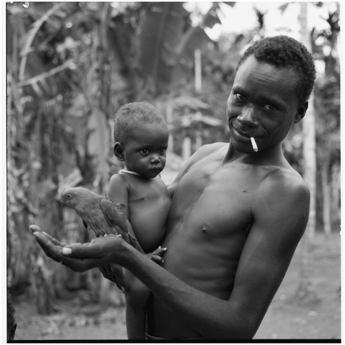 Man, infant and bird