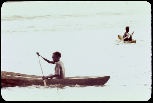 Boys in canoes