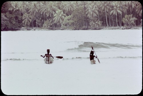 Boys in canoes