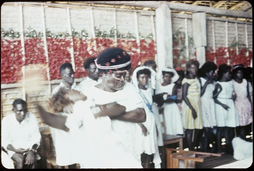 Holy Mama in a church with others