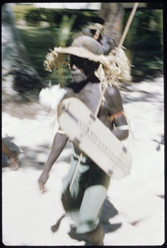 Dancer with shield and spear, and hat