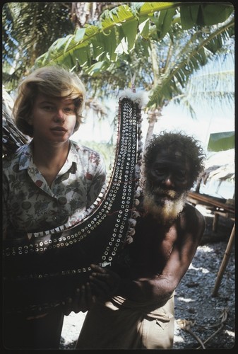 Frances Harwood and man with miniature canoe